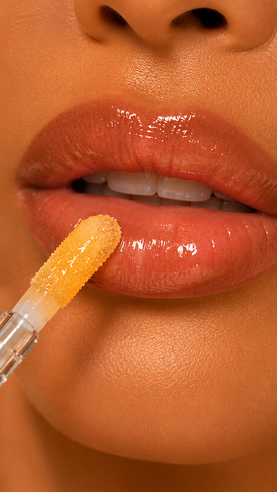 Marvfurry lip plumper applying a glassy finish